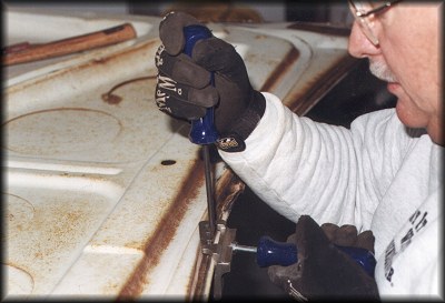 Un-crimping the trunk lid skin