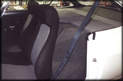 Installed Corv-8 engine cover and shoulder belts